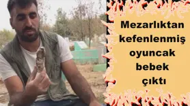 Mezarlıktan kefenlenmiş oyuncak bebek çıktı